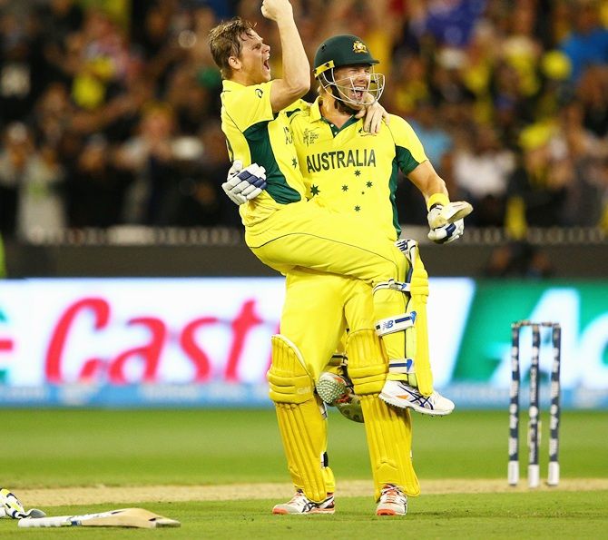Australia's Steven Smith celebrates with teammate Shane Watson after hitting the winning runs to beat New Zealand and win the 2015 ICC World Cup final at the Melbourne Cricket Ground on March 29