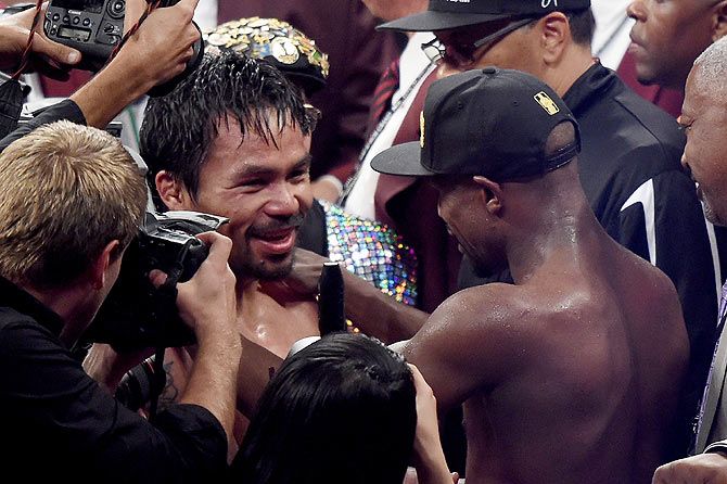 Floyd Mayweather Jr. hugs Manny Pacquiao after their bout