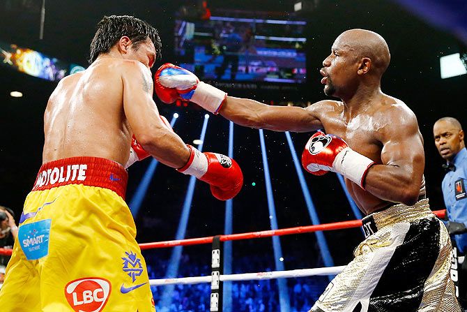 Floyd Mayweather Jr. throws a right at Manny Pacquiao 