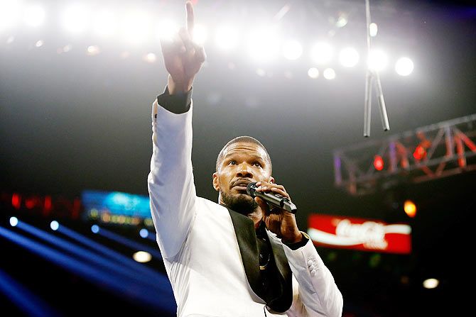 Jamie Foxx sings the national anthem of the United States of America before the welterweight unification championship bout between Floyd Mayweather Jr. and Manny Pacquiao