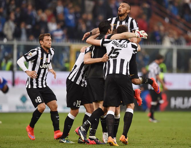 Players of Juventus FC celebrate after beating UC Sampdoria 1-0 to win the Serie A Championships at the end of the Serie A match at Stadio Luigi Ferraris in Genoa, Italy, on Saturday