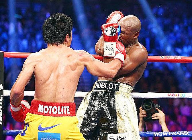 Floyd Mayweather and Manny Pacquiao box. Photograph: Mark J. Rebilas-USA TODAY Sports/Reuters