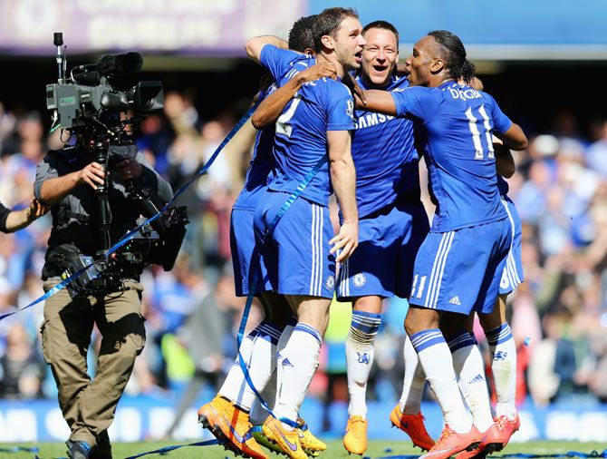 Chelsea's John Terry (centre), Branislav Ivanovic (left) and Didier Drogba (right) celebrate on winning the Premier League title after their match against Crystal Palace at Stamford Bridge on Sunday