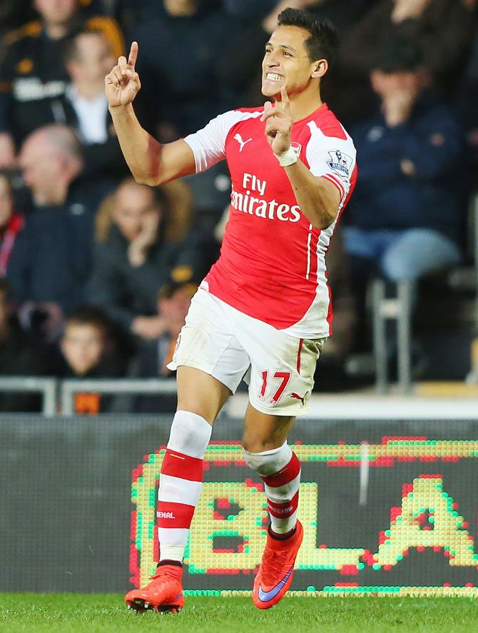 Alexis Sanchez of Arsenal celebrates his goal against Hull City during their English Premier League match at KC Stadium in Hull on Monday
