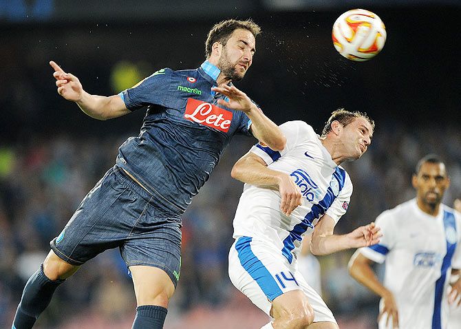 Napoli's player Gonzalo Higuain vies with FC Dnipro Dnipropetrovsk's Yevhen Cheberyachko during their UEFA Europa League first leg semi-final in Naples on Thursday