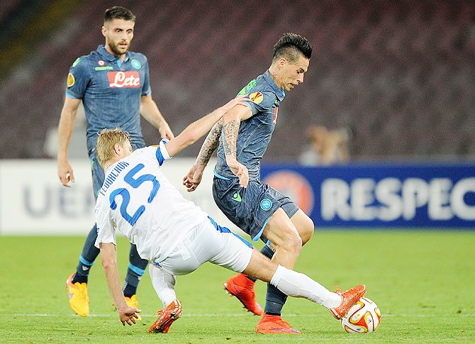 Marek Hamsik of Napoli is challenged by Valeriy Fedorchuk of FC Dnipro Dnipropetrovsk