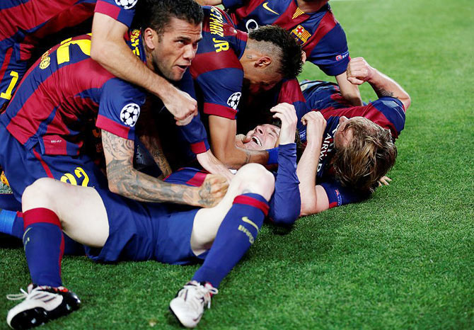 Barcelona's Lionel Messi celebrates with teammates after scoring against Bayern Munich in their Champions League first leg semi-final at the Camp Nou on May 6