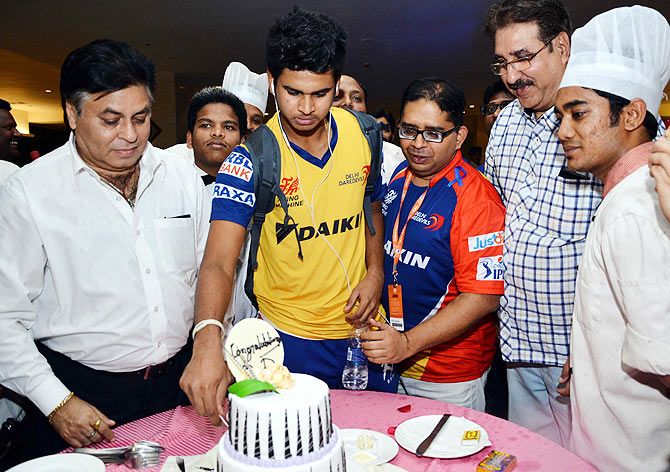 Delhi Daredevils' Shreyas Iyer cuts a cake as the team celebrates their win over Chennai Super Kings, with hotel staff