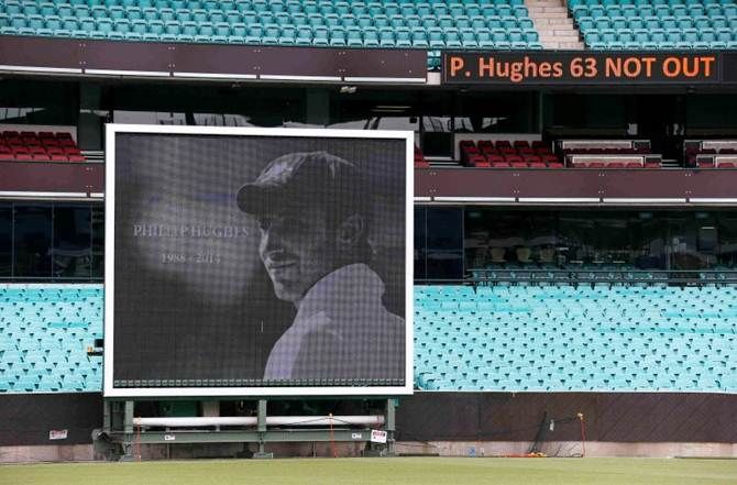 A scoreboard and side screen displays tributes to Phillip Hughes at the Sydney Cricket Ground on December 3, 2014