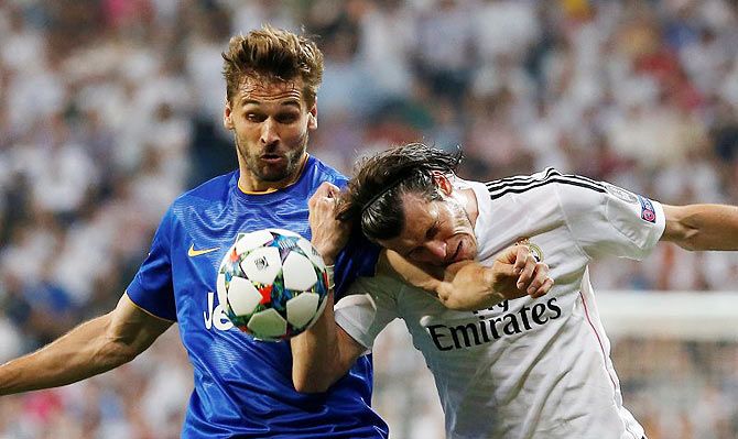 Juventus' Fernando Llorente and Real Madrid's Gareth Bale are tangled in a challenge