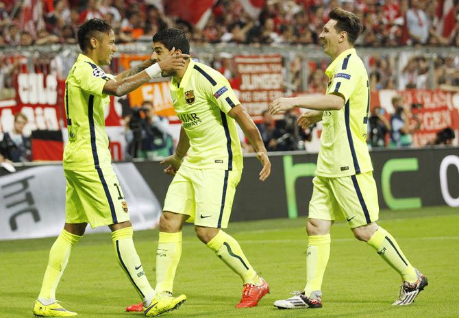 Neymar celebrates with Luis Suarez and Lionel Messi after scoring the second goal for Barcelona against Bayern Munich during their Champions League second leg semi-final on Tuesday