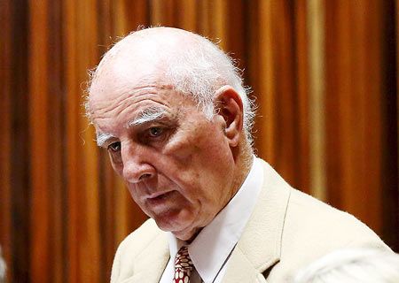 Former Grand Slam doubles champion Bob Hewitt looks on ahead of court proceedings at the South Gauteng High Court in Johannesburg 