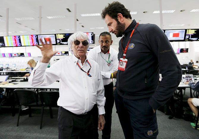 Formula One supremo Bernie Ecclestone (left) speaks to Matteo Bonciani (right), FIA media delegate