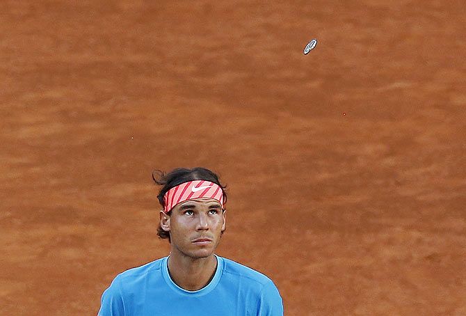 Spain's Rafael Nadal looks up during the coin toss before the match