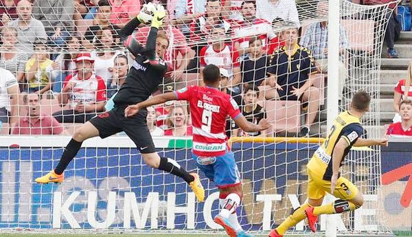 Granada goalkeeper Kelava makes a save against Atletico Madrid during their La Liga match on Saturday