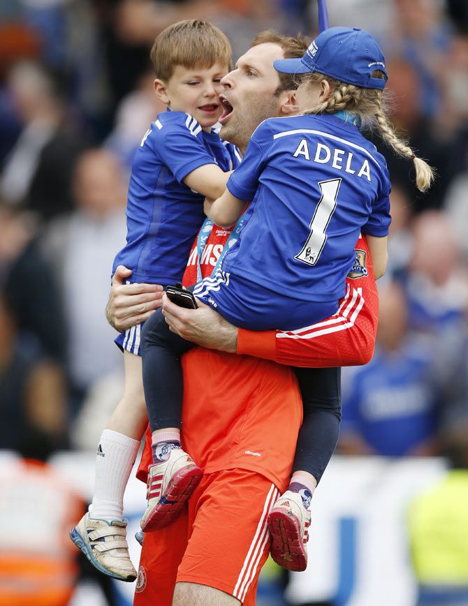 Chelsea's Petr Cech celebrates with family after winning the Barclays Premier League