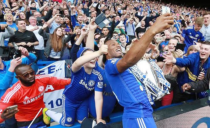 Chelsea's Didier Drogba takes a selfie with fans on Sunday