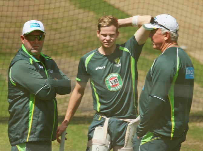 Darren Lehmann, coach of Australia; Steven Smith of Australia and Craig McDermott, Australia's bowling coach talk during an Australian nets session