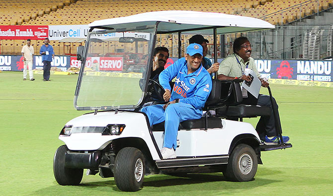 MS Dhoni, captain of India, drives to the press con 