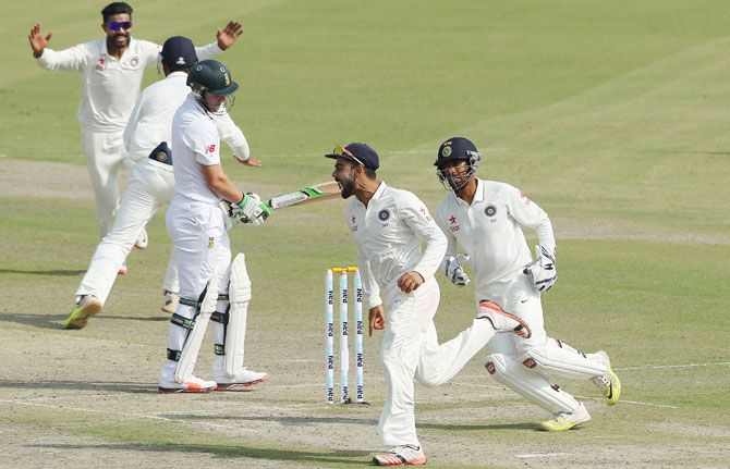 Virat Kohli, the captain of India, celebrates the wicket of AB de Villiers of South Africa only to have the decision reversed due to a no ball during day two of the opening Test in Mohali