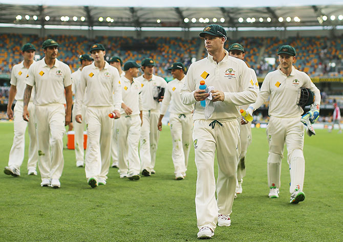 Steve Smith leads the Australian team off at the end of play 