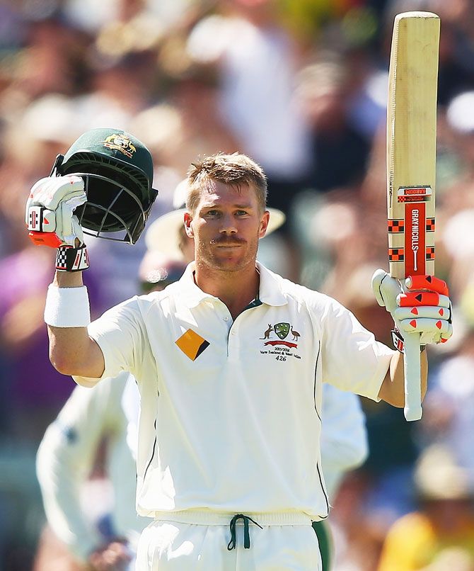 Australia's David Warner celebrates after reaching his century on Day 1 of the second Test match against New Zealand at the WACA in Perth on Friday