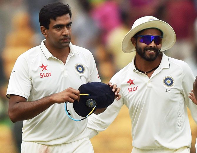 India's Ravichandran Ashwin and Ravindra Jadeja return to the pavilion after the end of the South Africa's firdy innings on Saturday