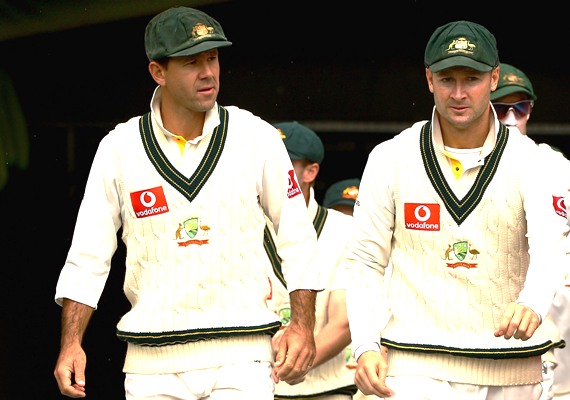Ricky Ponting and Michael Clarke of Australia lead their team to the field during an Ashes Test 