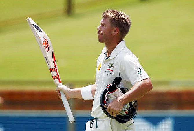Australia's David Warner waves to the crowd as he walks off the ground after being dismissed for 253 runs during the second day of the second Test match against New Zealand at the WACA ground in Perth, on Saturday
