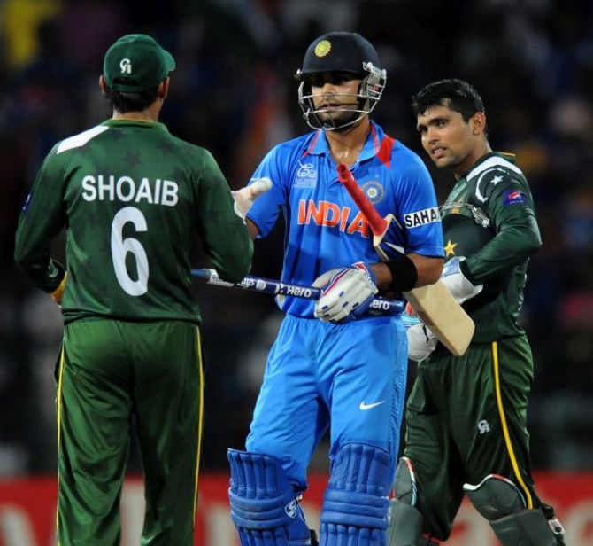 India's Virat Kholi is congratulated by Shoaib Malik of Pakistan after a game