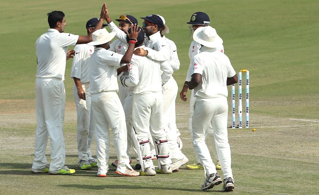 India's Ravichandran Ashwin celebrates with teammates the fall of a South African wicket 