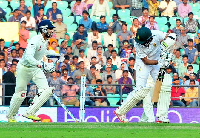 Indian bowler Ravindra Jadeja celebrates with his teammates 