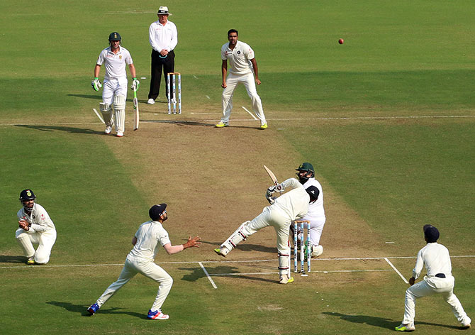 India's R Ashwin looks on as JP Duminy of South Africa edges the ball to the slips 