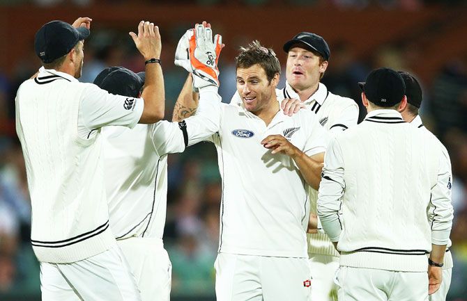 New Zealand's Doug Bracewell celebrates dismissing Australia's Joe Burns on Day 1 of the Third Test at Adelaide Oval in Adelaide on Friday