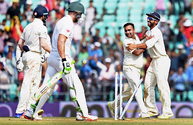 Indian bowler Amit Mishra celebrates the wicket of South Africa's batsman Faf du plessis on the third day of the 3rd Test match played in Nagpur on Friday