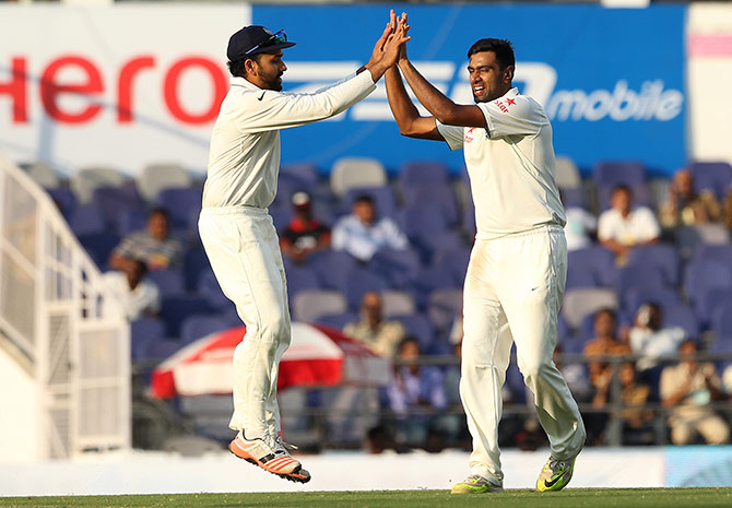 India's Ravichandran Ashwin celebrates taking a South African wicket 