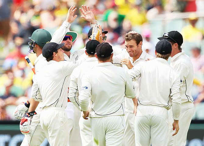 New Zealand's Doug Bracewell is congratulated by teammates after taking the wicket of Australia's Mitch Marsh during Day 2 of the Third Test at Adelaide Oval in Adelaide on Saturday