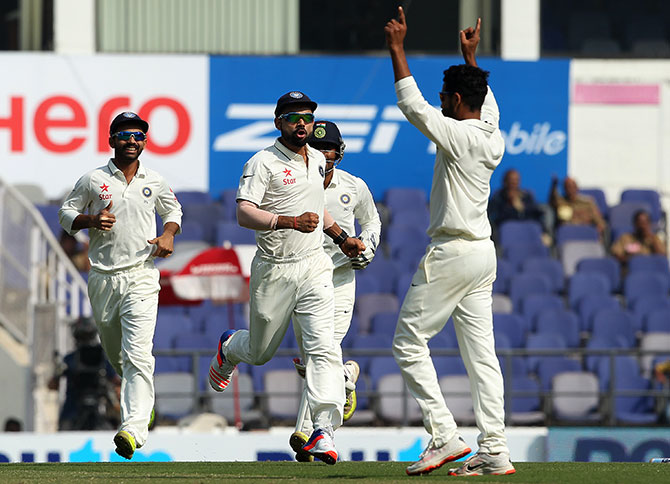 Indian players celebratebthe dismissal of South Africa's Faf du Plessis during the third Test in Nagpur 