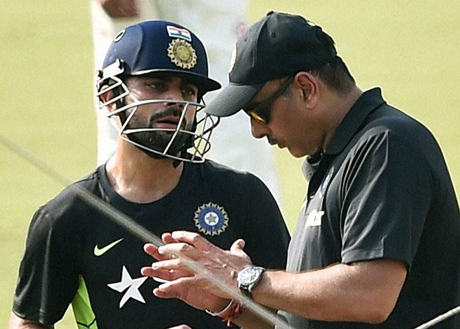 Indian Team Director Ravi Shastri with captain Virat Kohli during their training session 