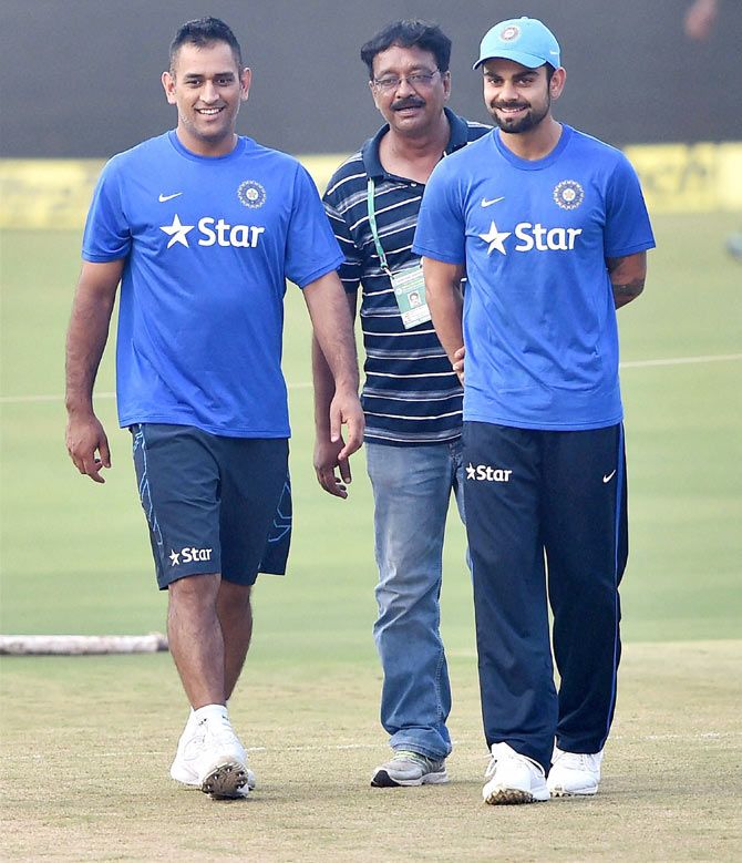 Indian captain Mahendra Singh Dhoni and vice-captain Virat Kohli inspect the pitch with the groundsman during the training session on Sunday, the eve of 2nd T20 Match against South Africa at Barabati Stadium in Cuttack