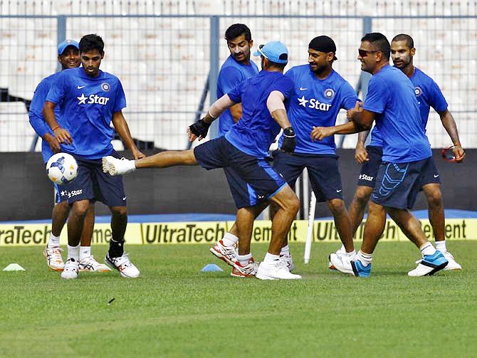 India's players play football during a training session
