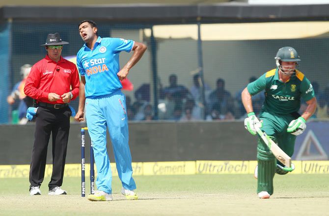 India's Ravichandran Ashwin winces in pain after diving to stop the ball during the 1st ODI at the Green Park Stadium in Kanpur on Sunday
