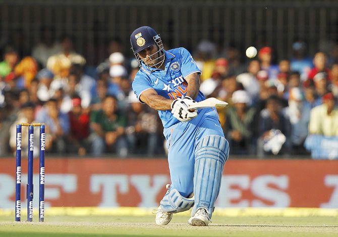 : India's captain Mahendra Singh Dhoni hits a shot enroute his match-winning innings of 92 runs