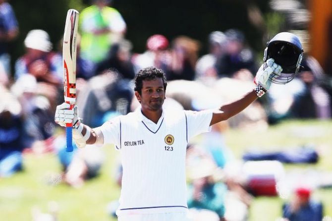 Dimuth Karunaratne of Sri Lanka celebrates after scoring a century
