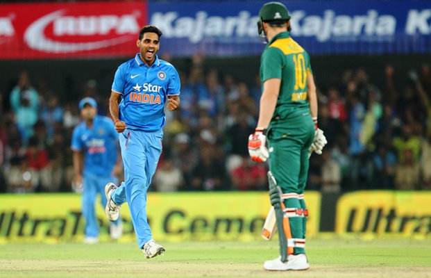 Bhuvneshwar Kumar of India celebrates the wicket of David Miller 