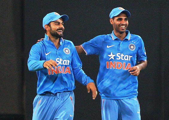 Bhuvneshwar Kumar of India celebrates with teammate Virat Kohli 