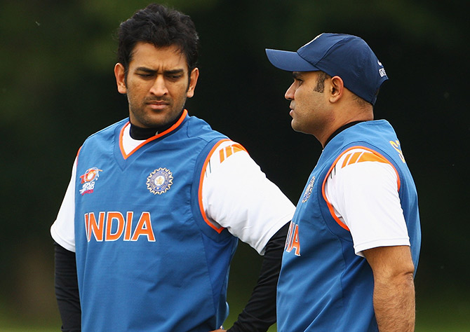 MS Dhoni, captain of India, talks to Virender Sehwag 