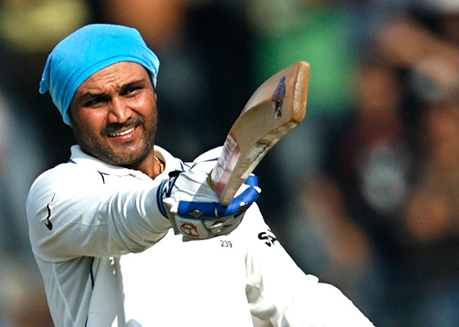 India's Virender Sehwag celebrates after scoring a double century 