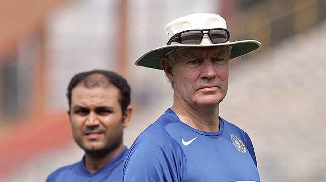 Former India coach Greg Chappell (right) with Virender Sehwag during a practice session 