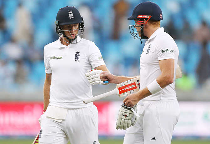 England's Joe Root and Jonny Bairstow walk off at the end 